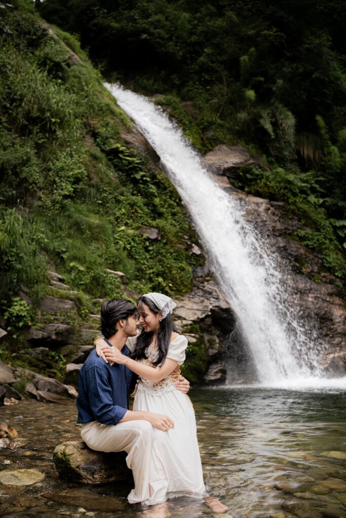 Khushi and Ujjwal pre-wedding shoot by a waterfall in Shangarh, Himachal